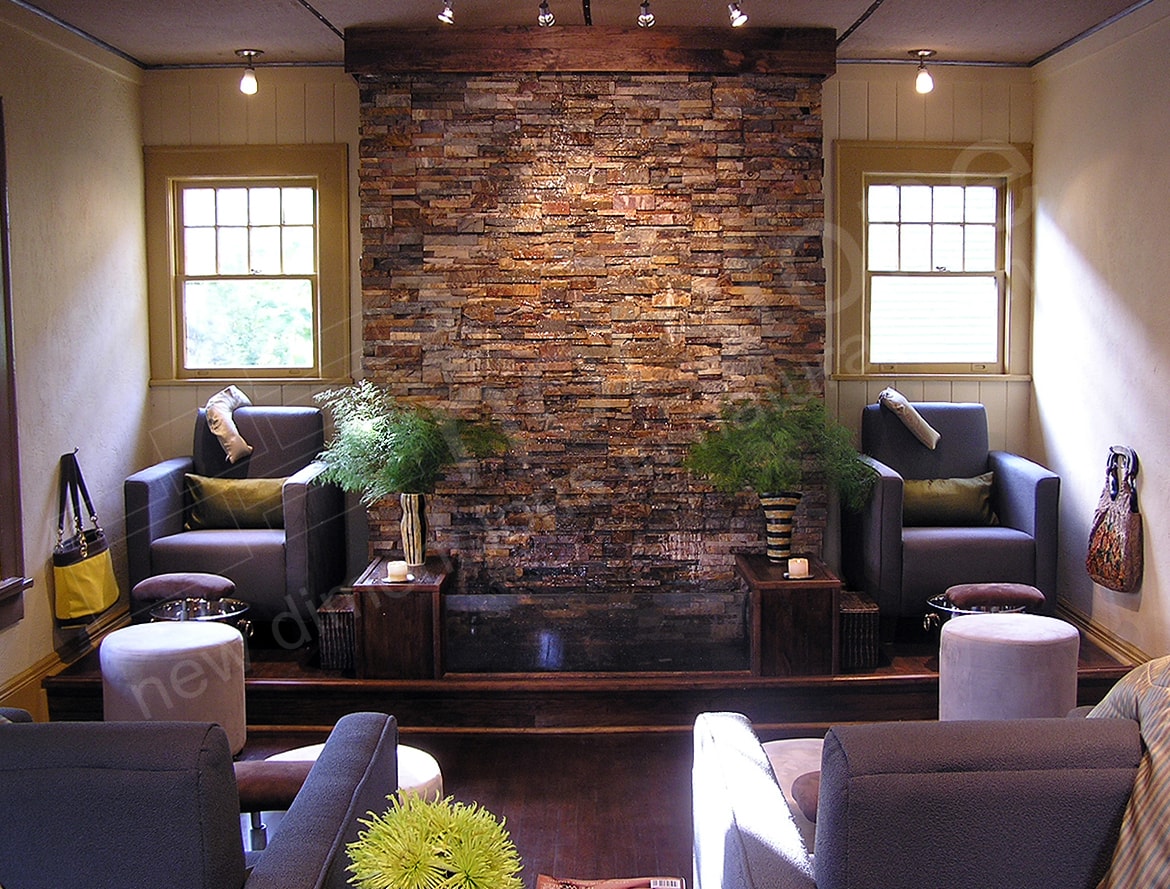 Interior stacked stone water feature wall